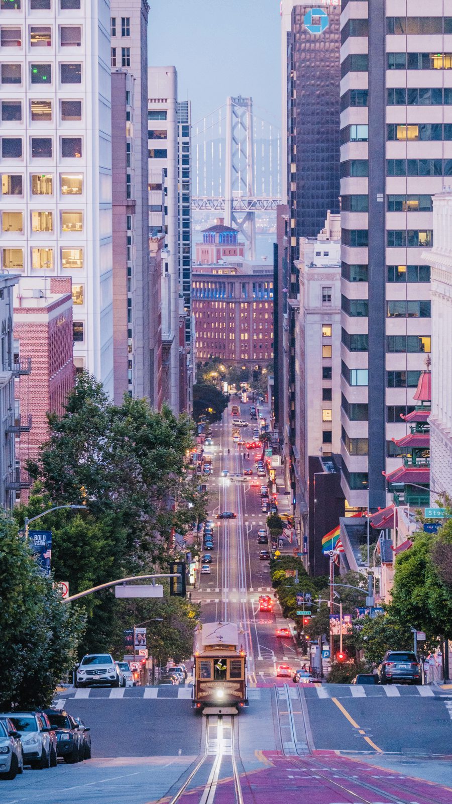 Cable car on California Street with the Bay Bridge in view, San Francisco